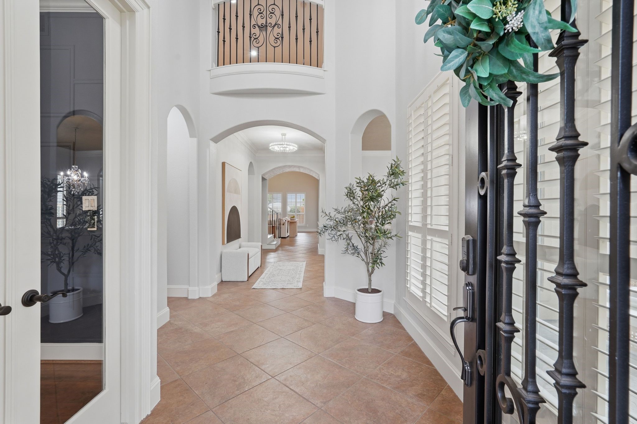 7603 Hogan Bridge Court Spring, TX 77389 - Photo 3 of 50 Step into a light-filled foyer where elegant details and open space create an immediate sense of warmth and sophistication.