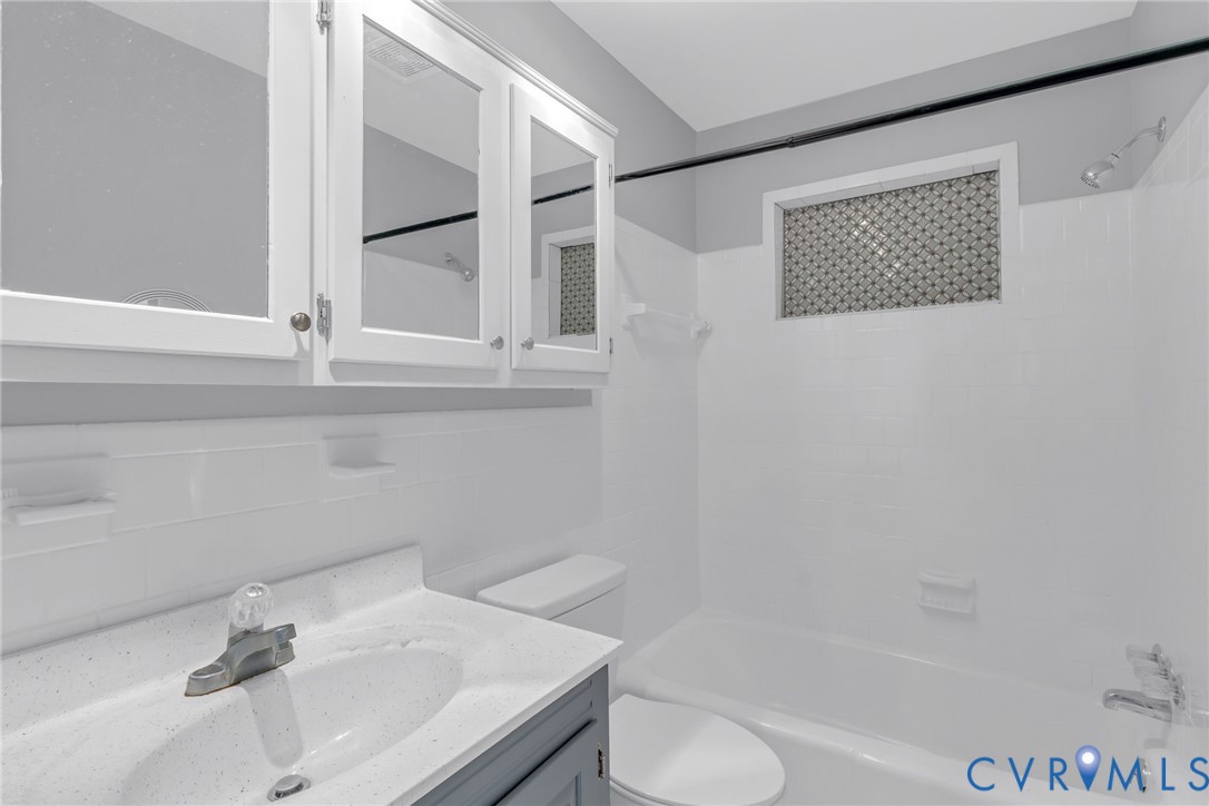 1928 Lake Road Lottsburg, VA 22511 - Photo 18 of 47 a bathroom with a sink toilet and shower
