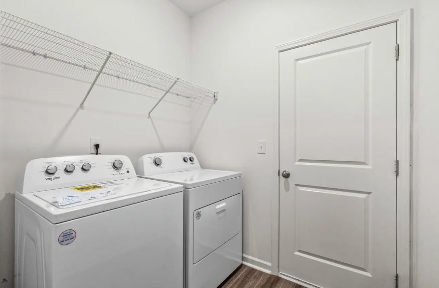 18200 Papuan Cove Elgin, TX 78621 - Photo 19 of 21 a utility room with dryer and washer