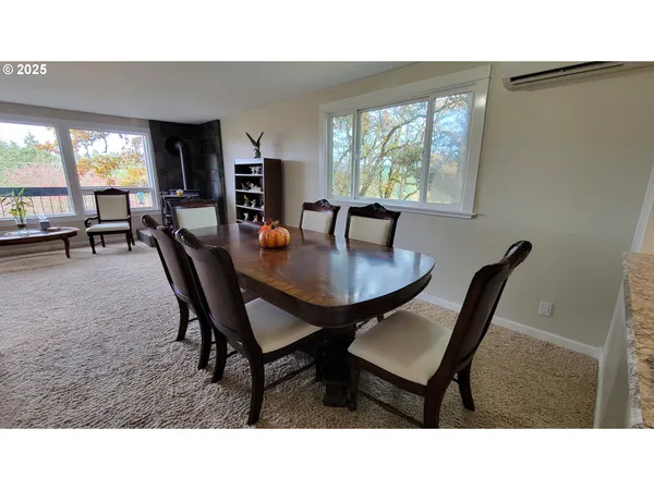 a dining room with furniture and window