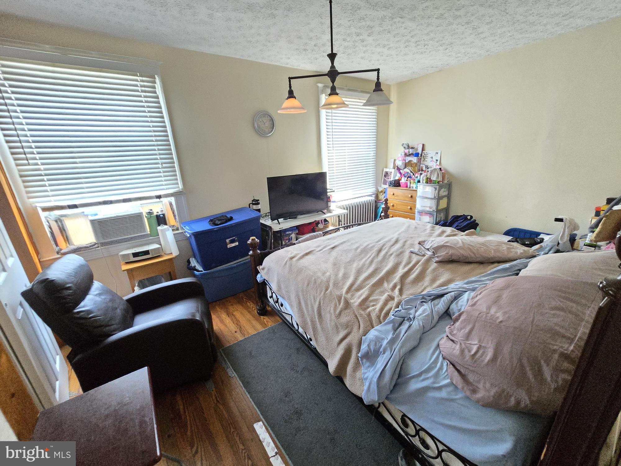 816 Primson Avenue Baltimore, MD 21229 - Photo 19 of 23 a bedroom with two beds and a couch