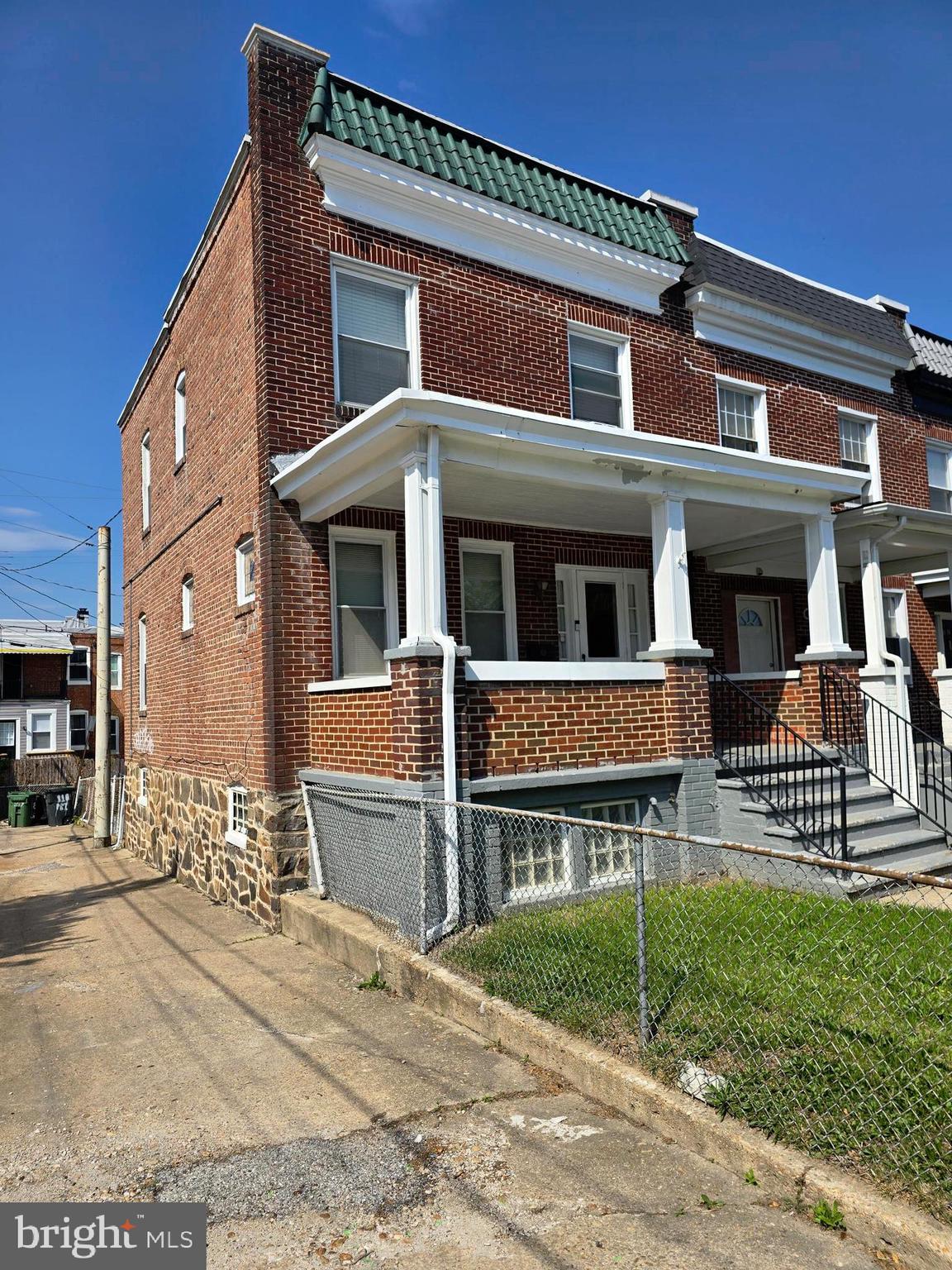 816 Primson Avenue Baltimore, MD 21229 - Photo 3 of 23 a front view of a house with a yard