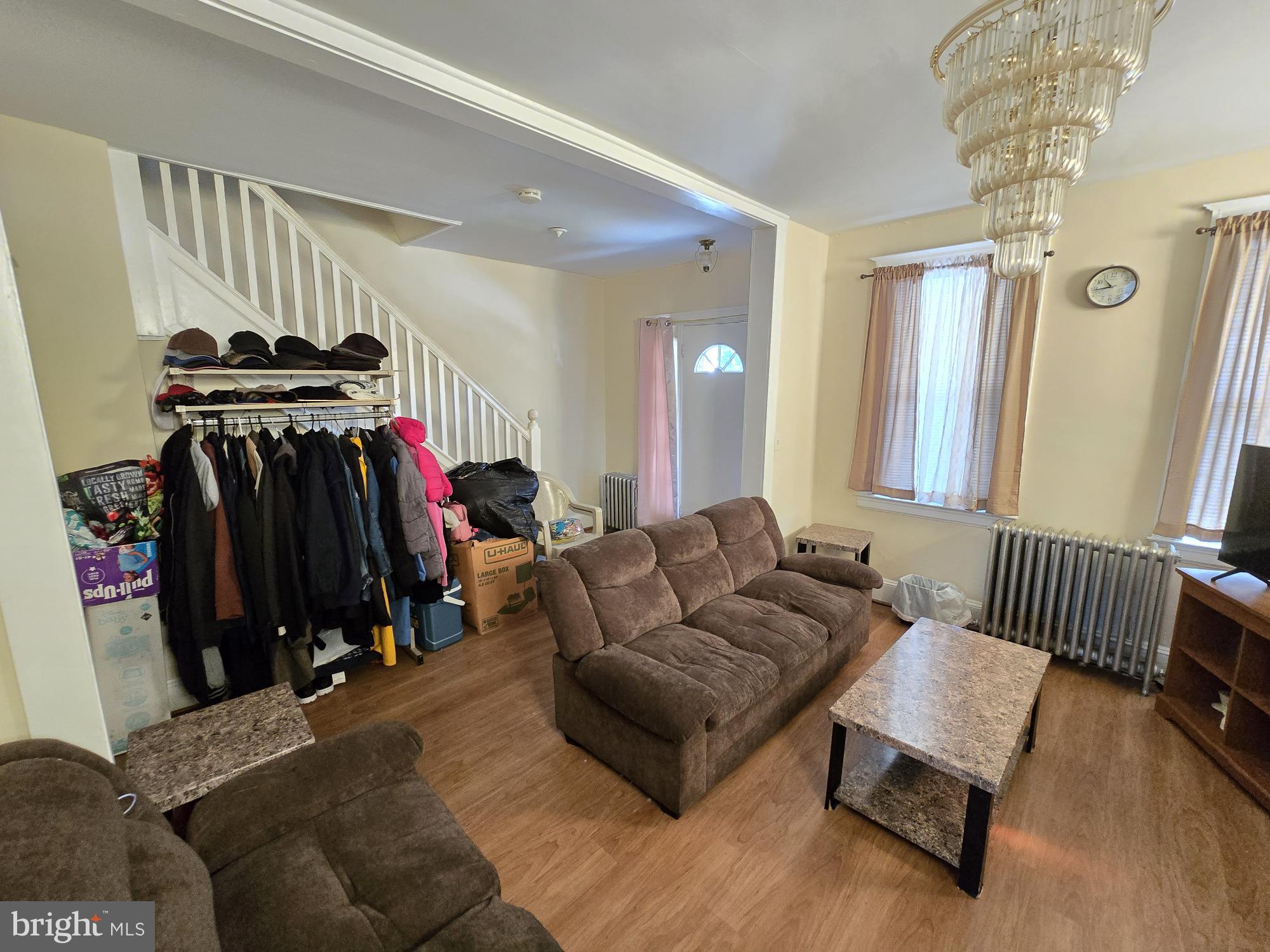816 Primson Avenue Baltimore, MD 21229 - Photo 8 of 23 a living room with furniture and a mirror