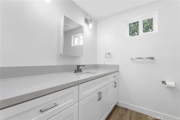 a bathroom with a sink and vanity