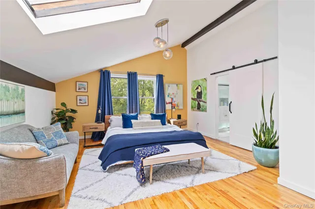 a living room with patio furniture and a potted plant