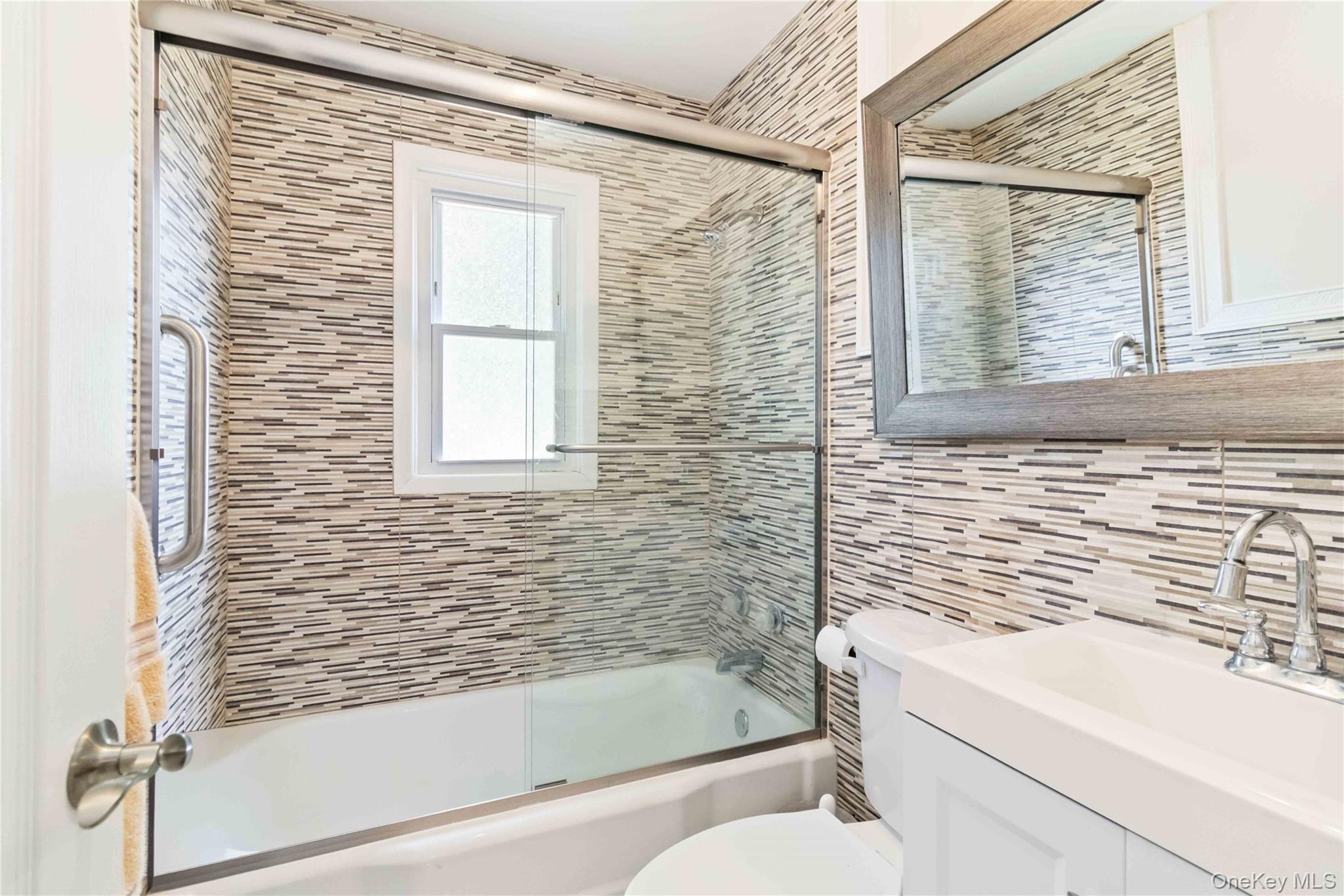 46 Woodland Road Monroe, NY 10950 - Photo 13 of 39 a bathroom with a sink a toilet and a bathtub