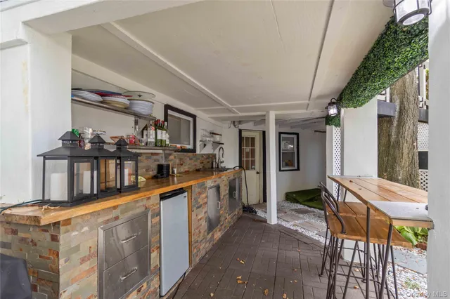 a kitchen with stainless steel appliances granite countertop lots of counter top space and wooden floor