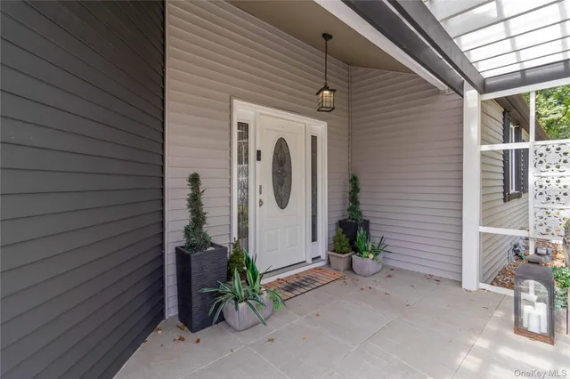 a view of a porch with wooden fence