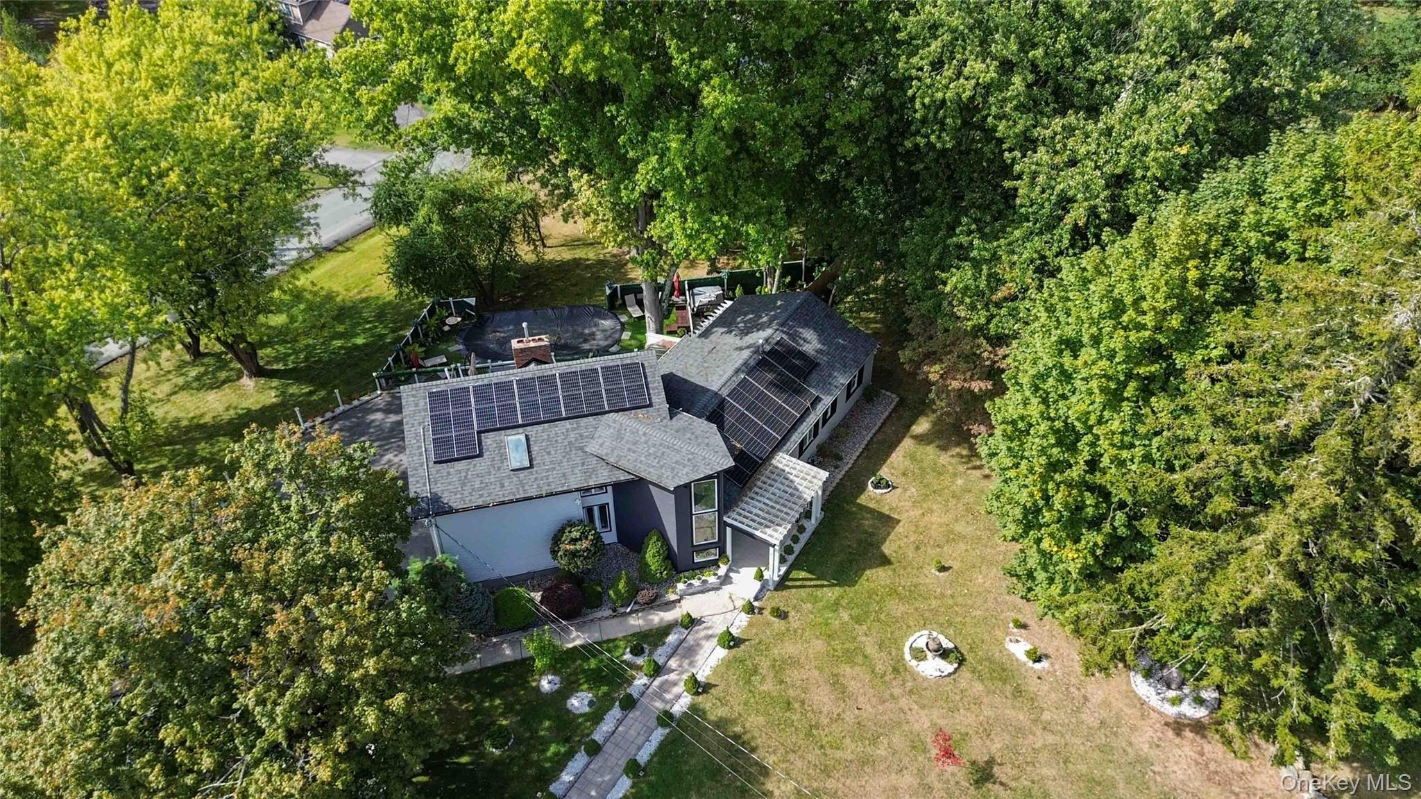 46 Woodland Road Monroe, NY 10950 - Photo 34 of 39 an aerial view of a house with a yard