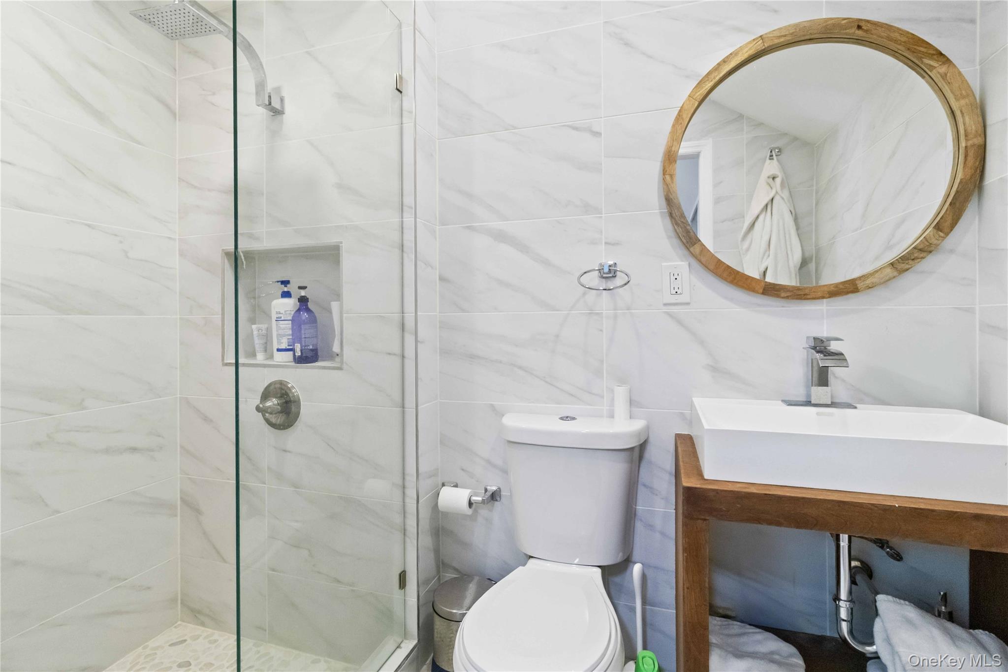 46 Woodland Road Monroe, NY 10950 - Photo 7 of 39 a bathroom with a sink a toilet and a mirror