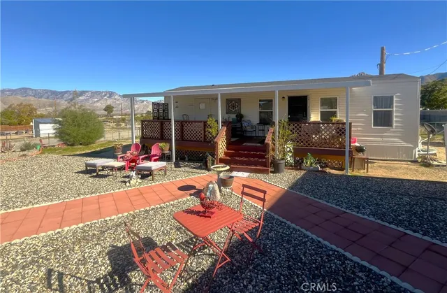swimming pool view with a seating space