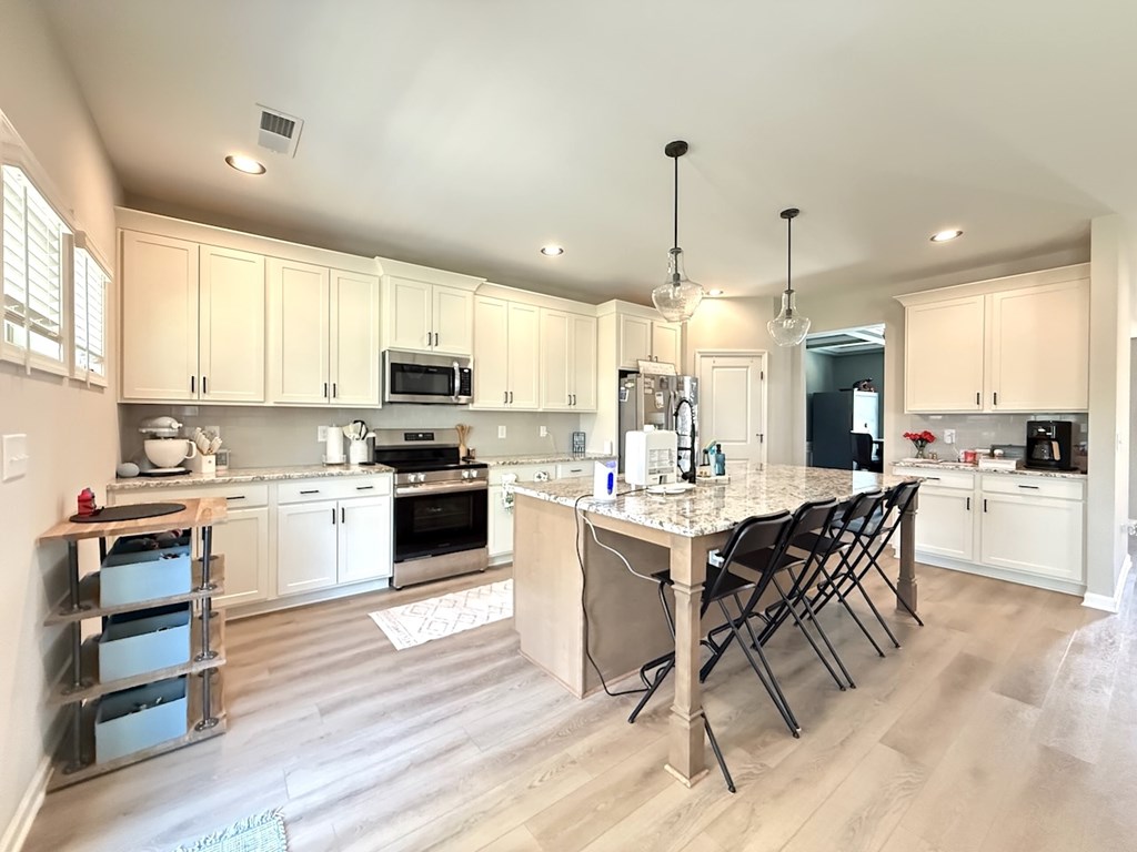 33 Sugar Maple Drive Fort Mitchell, AL 36856 - Photo 9 of 29 a kitchen with a sink a counter top stainless steel appliances and cabinets