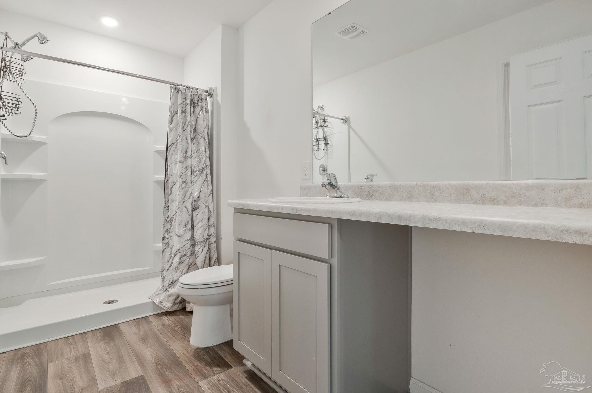 1625 Addies Way Pensacola, FL 32534 - Photo 27 of 50 a bathroom with a sink a toilet and shower