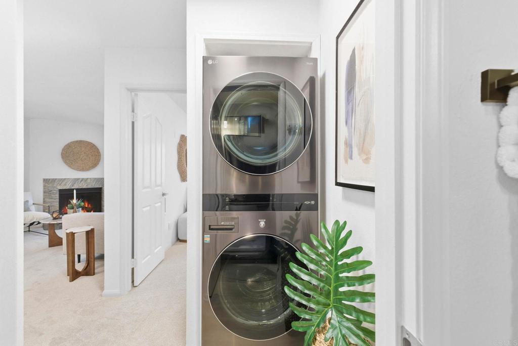 1750 South El Camino Real, Unit 211 Encinitas, CA 92024 - Photo 26 of 44 a living room with furniture and a fireplace