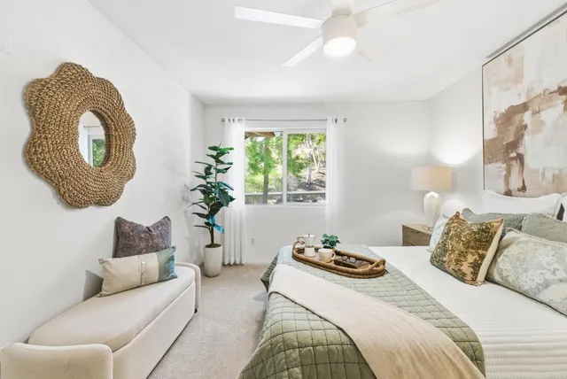 a bedroom with a bed and a couch