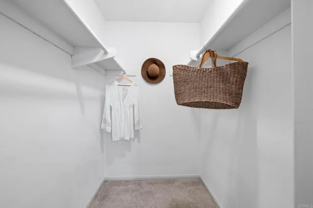 an aerial view of a residential houses with city view