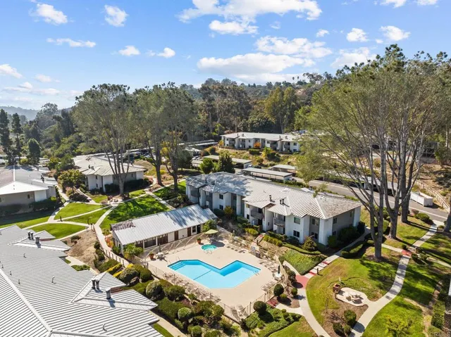 a view of a swimming pool with outdoor seating