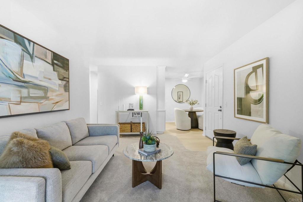 1750 South El Camino Real, Unit 211 Encinitas, CA 92024 - Photo 7 of 44 a living room with furniture and a couch
