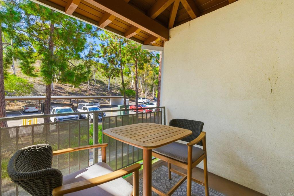 1750 South El Camino Real, Unit 211 Encinitas, CA 92024 - Photo 9 of 44 a balcony with table and chairs