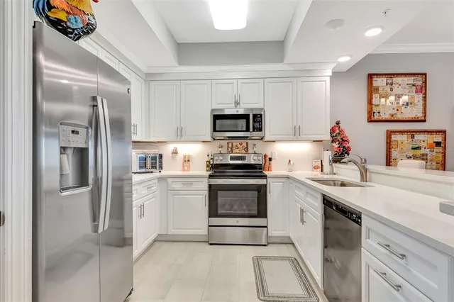 a kitchen with a sink stove and refrigerator