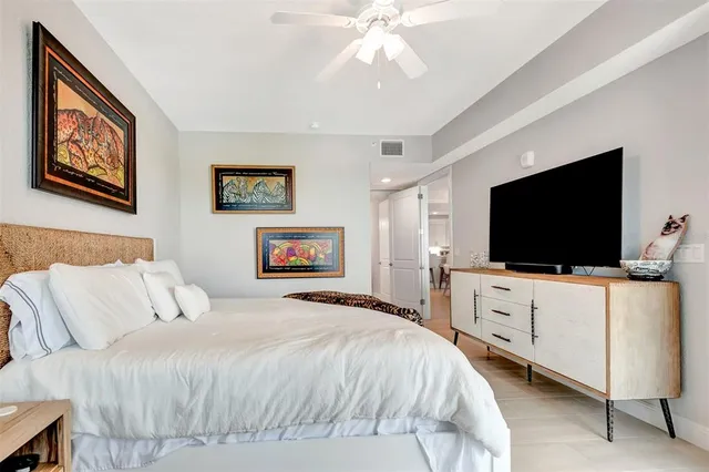 a spacious bathroom with a toilet sink and mirror