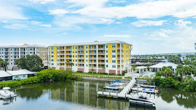 a view of a house with backyard porch and sitting area