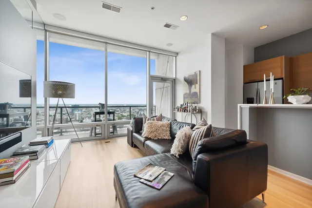 a living room with furniture and a large window