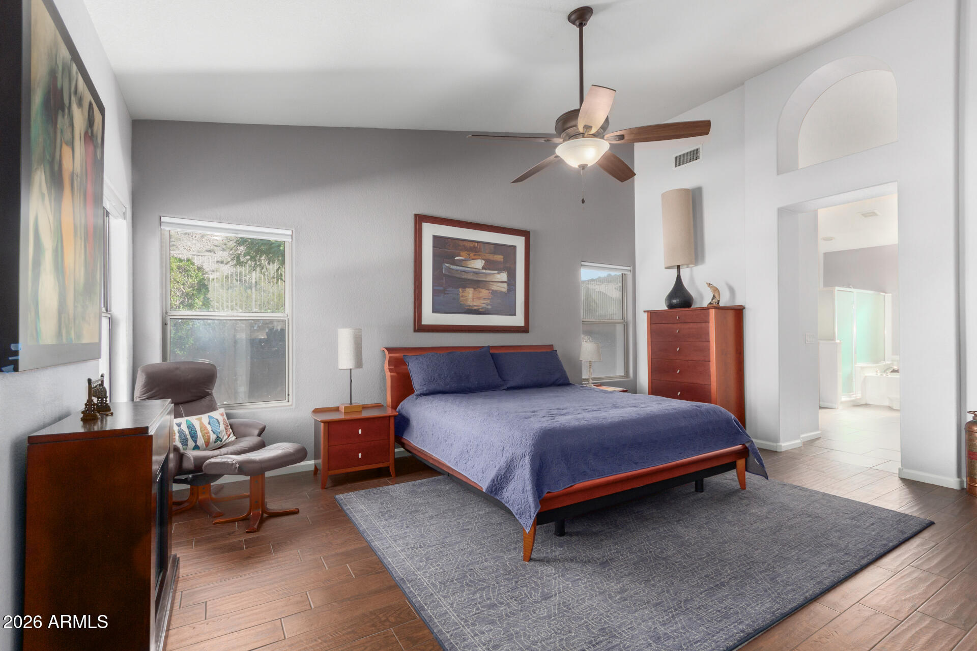 21009 North 16th Way Phoenix, AZ 85024 - Photo 15 of 39 a bedroom with a bed and wooden floor