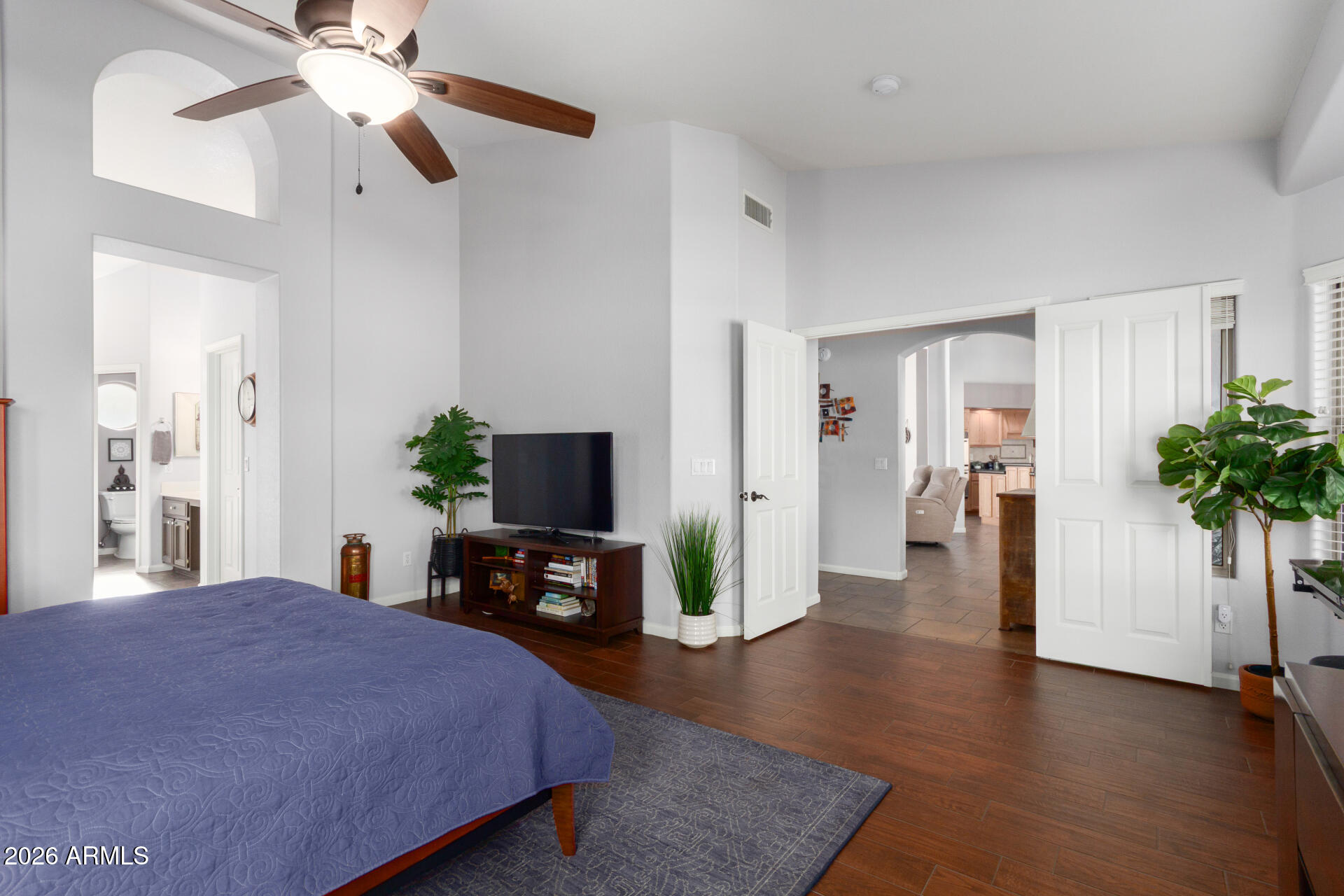 21009 North 16th Way Phoenix, AZ 85024 - Photo 16 of 39 a bedroom with a bed and a flat tv screen on a dresser