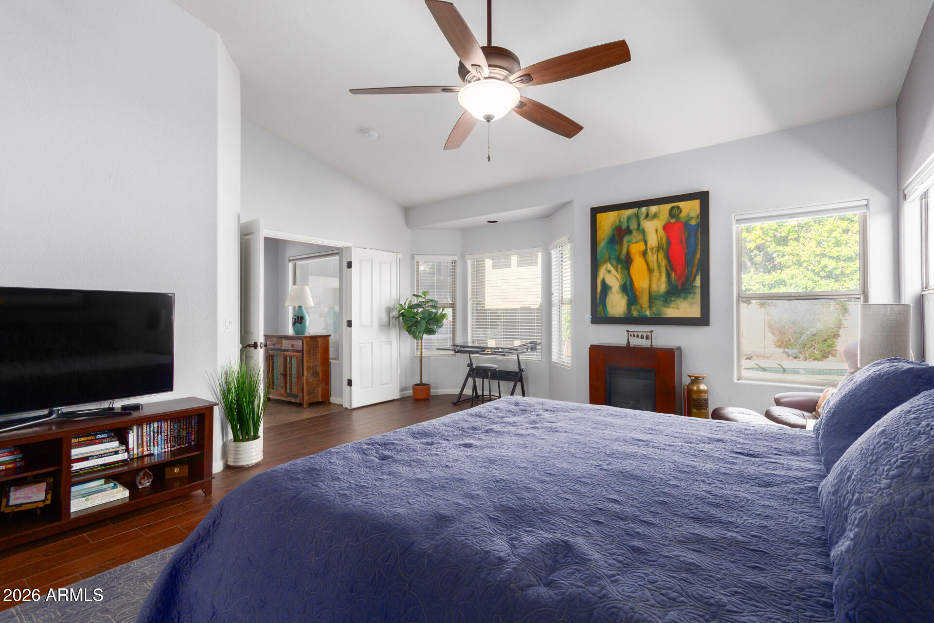 21009 North 16th Way Phoenix, AZ 85024 - Photo 17 of 39 a bedroom with a bed and a flat screen tv