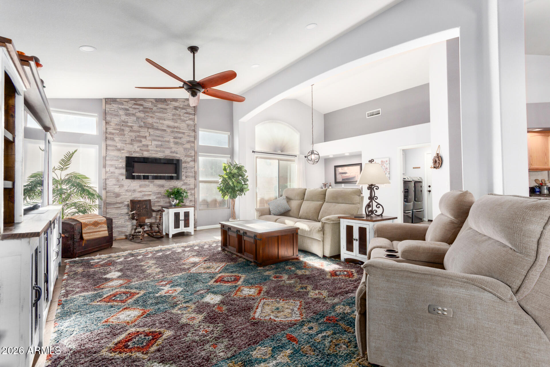 21009 North 16th Way Phoenix, AZ 85024 - Photo 2 of 39 a living room with furniture a fireplace and a flat screen tv