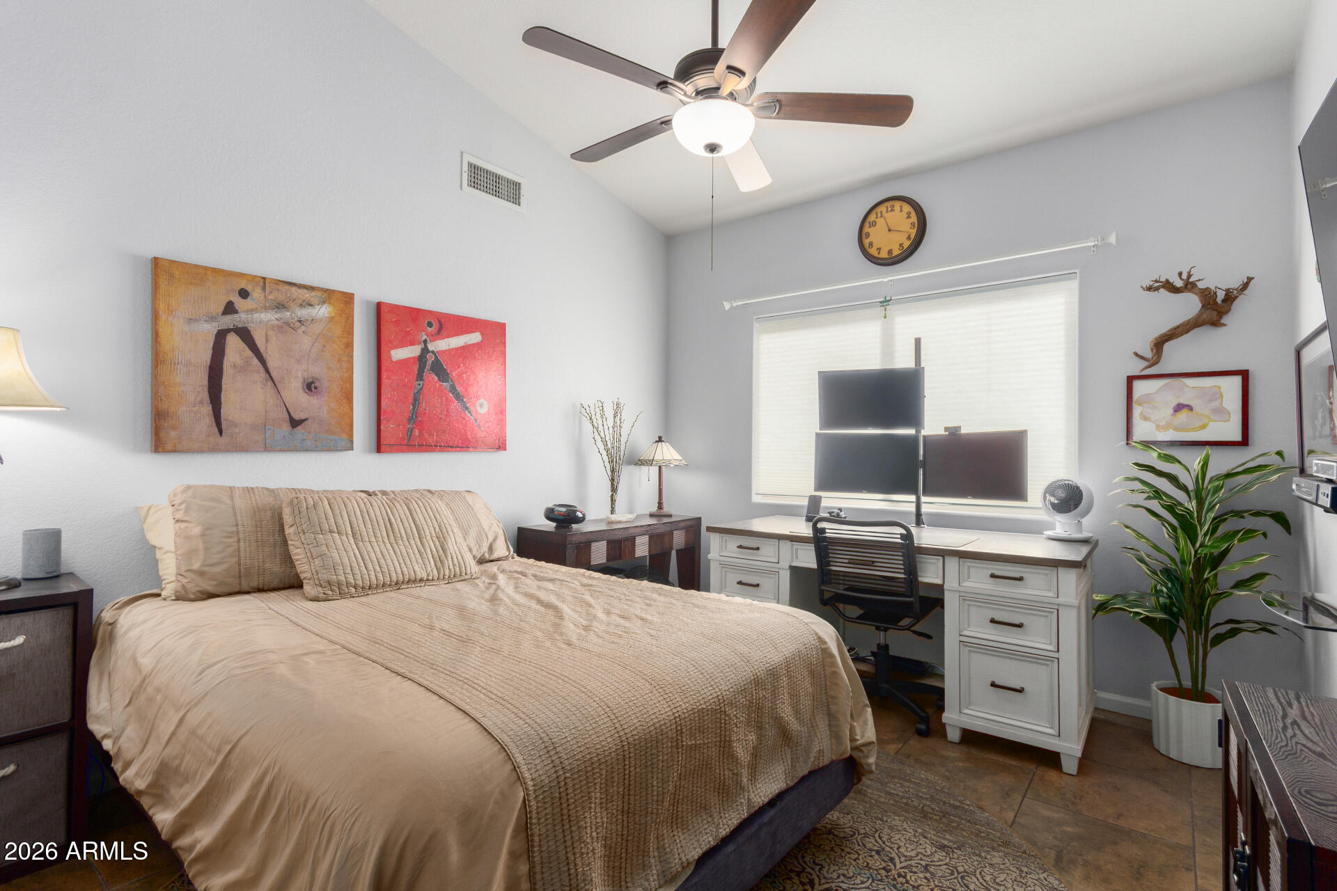 21009 North 16th Way Phoenix, AZ 85024 - Photo 22 of 39 a bedroom with a large bed and a chandelier