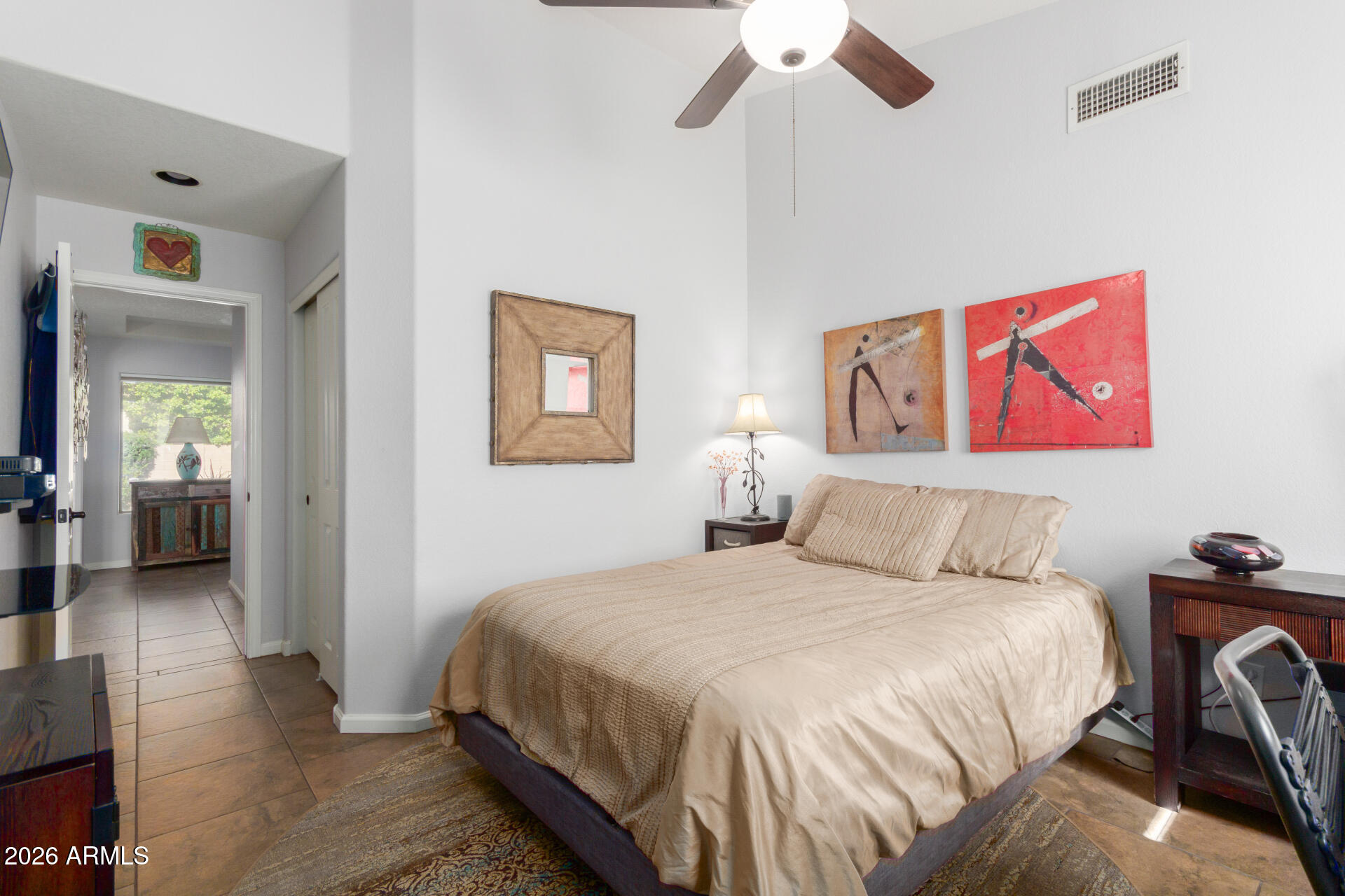 21009 North 16th Way Phoenix, AZ 85024 - Photo 23 of 39 a bedroom with a bed and a chandelier