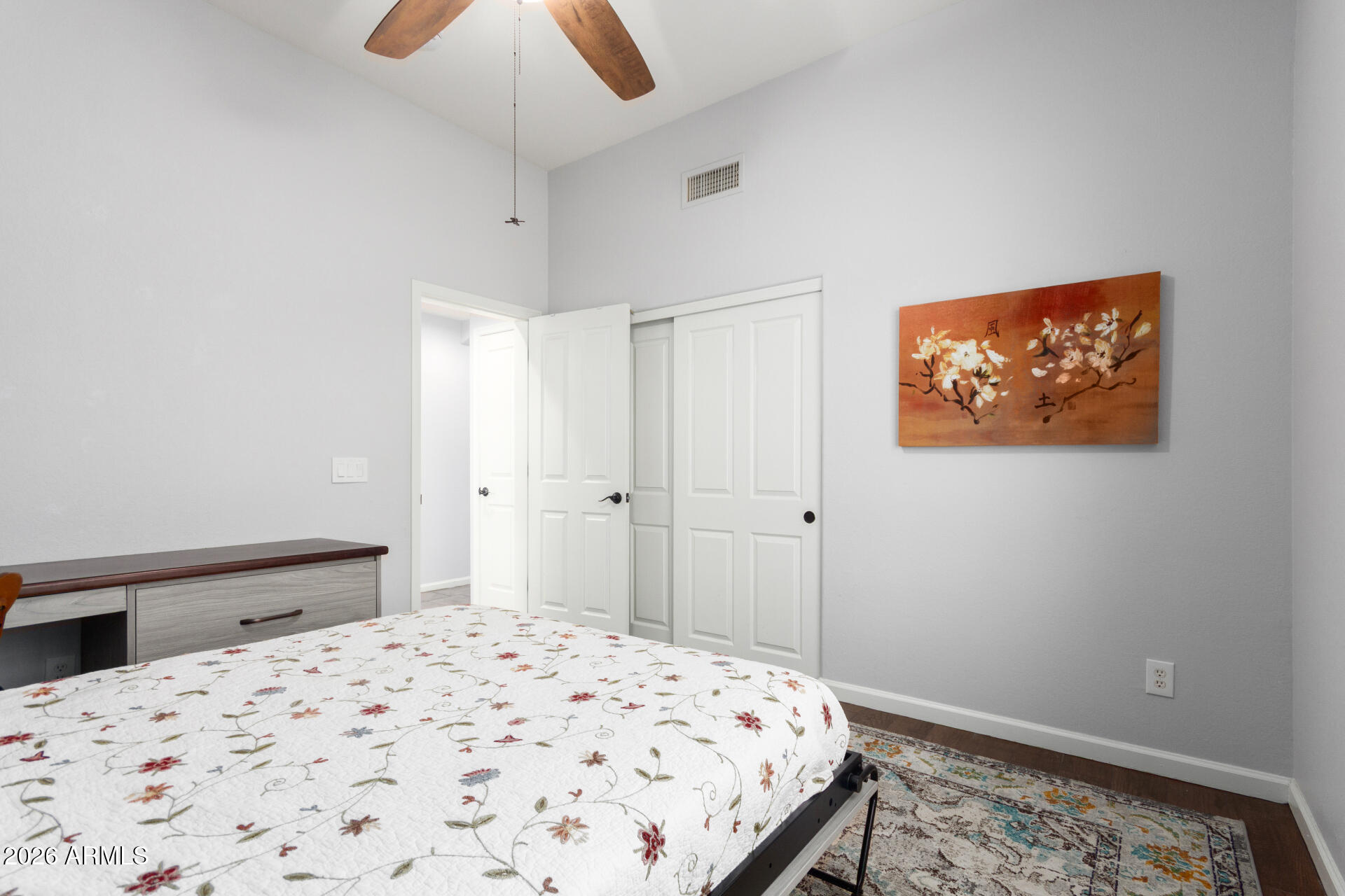 21009 North 16th Way Phoenix, AZ 85024 - Photo 30 of 39 a bedroom with a bed and a painting on the wall