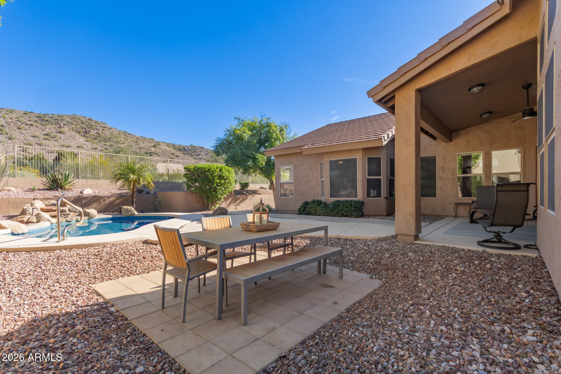 21009 North 16th Way Phoenix, AZ 85024 - Photo 32 of 39 a view of a patio with a table and chairs under an umbrella