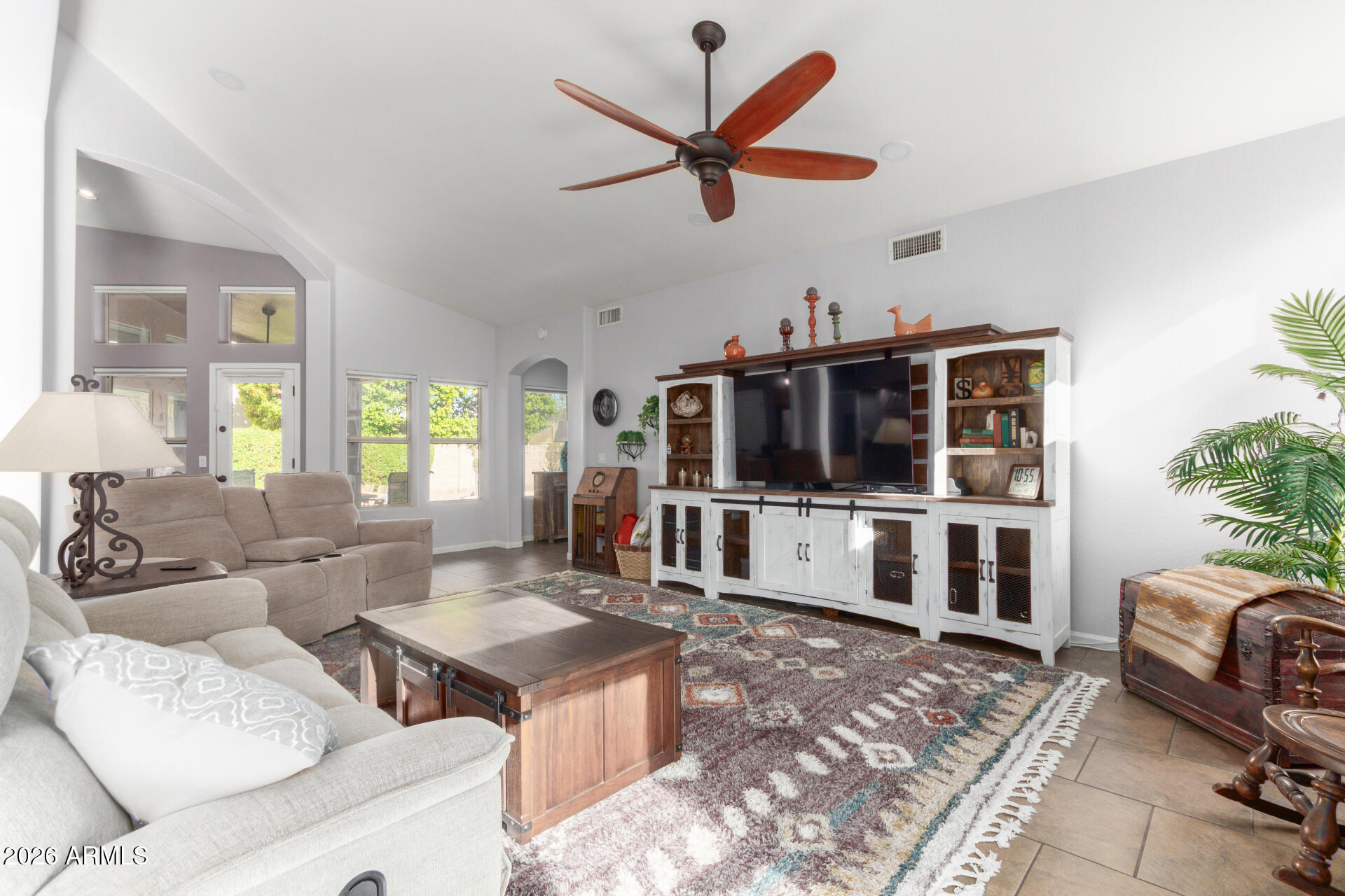 21009 North 16th Way Phoenix, AZ 85024 - Photo 4 of 39 a living room with furniture ceiling fan and a window