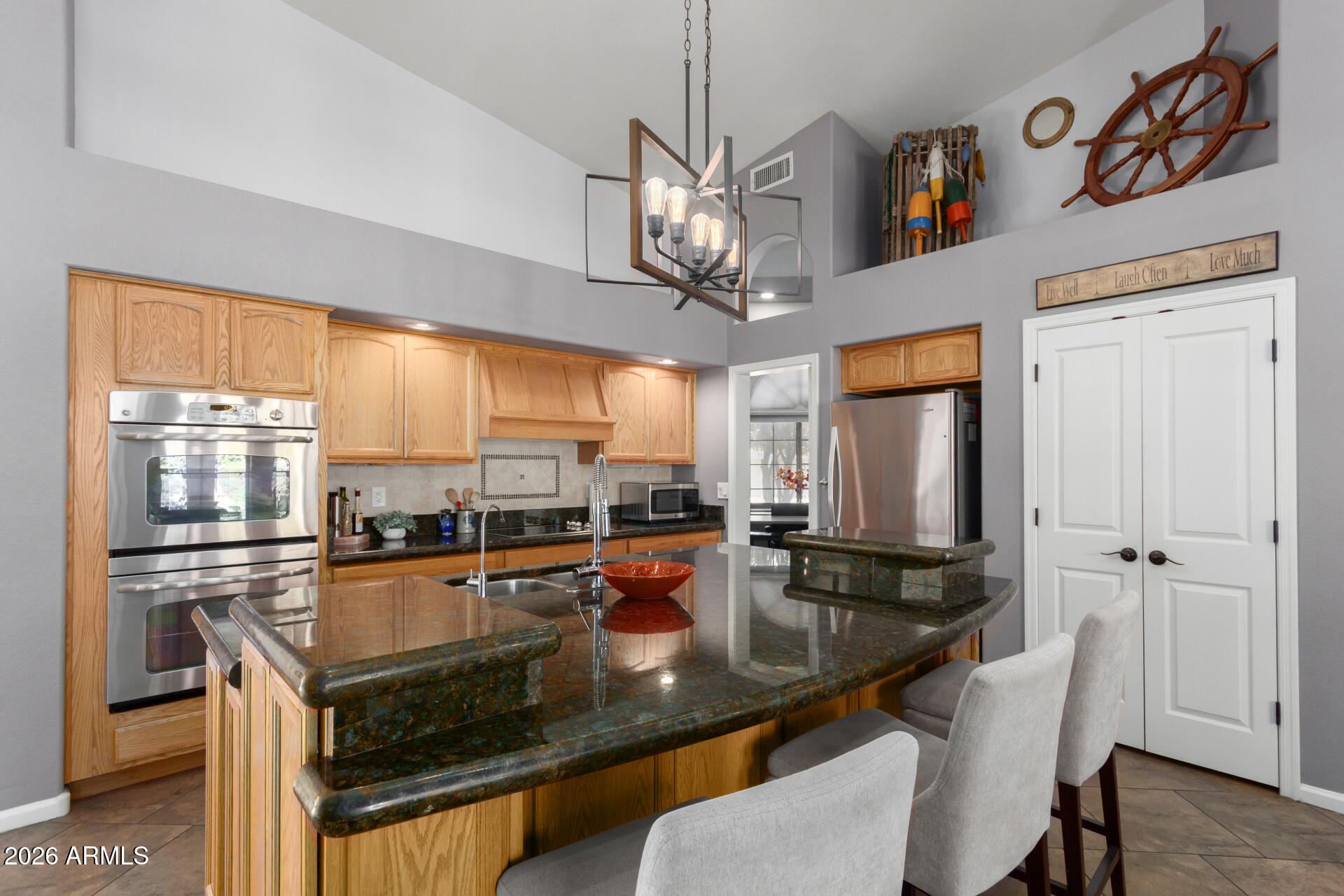 21009 North 16th Way Phoenix, AZ 85024 - Photo 6 of 39 a kitchen with stainless steel appliances granite countertop a sink a stove and a refrigerator