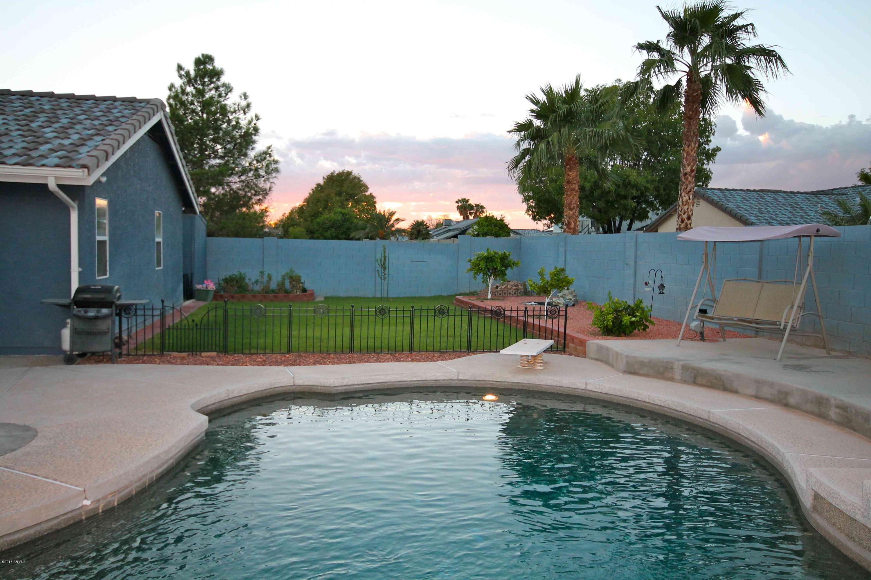 7932 West Bloomfield Road Peoria, AZ 85381 - Photo 34 of 41 pool and grass