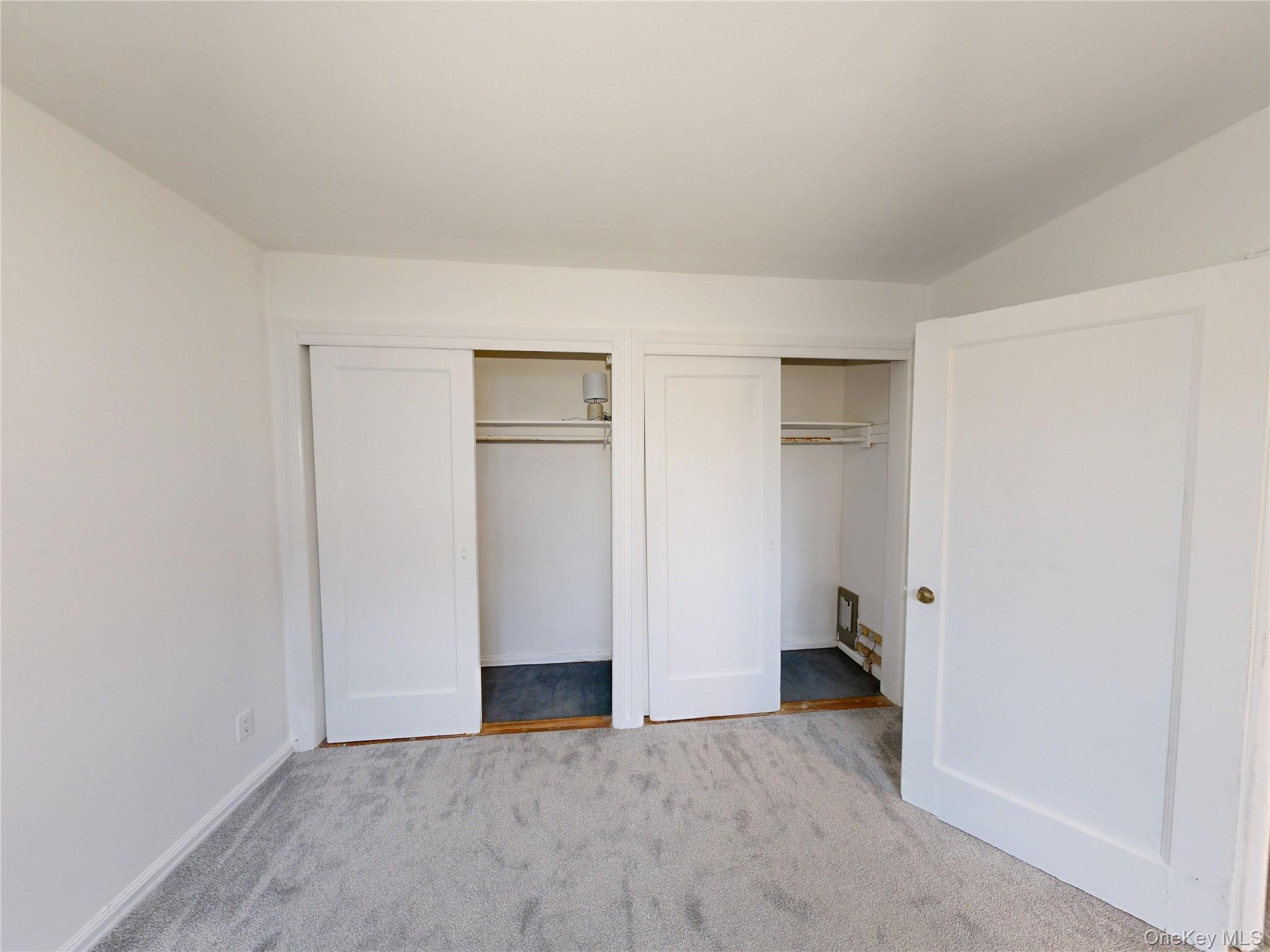 61 White Oak Street, Unit 3A New Rochelle, NY 10801 - Photo 3 of 12 wooden floor in an empty room