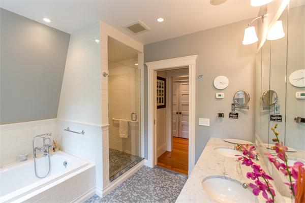 19 Cushing Road Wellesley, MA 02481 - Photo 16 of 29 a bathroom with a tub shower sink and mirror