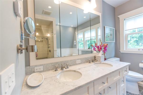 19 Cushing Road Wellesley, MA 02481 - Photo 17 of 29 a bathroom with a granite countertop sink mirror and a shower