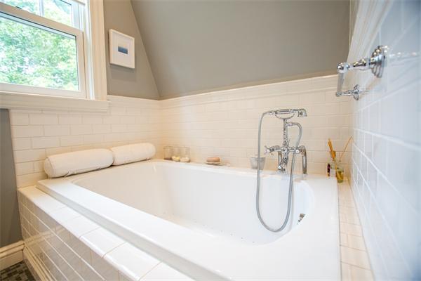 19 Cushing Road Wellesley, MA 02481 - Photo 19 of 29 a bathroom with a bath tub with a shower