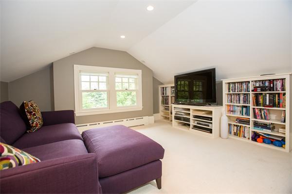 19 Cushing Road Wellesley, MA 02481 - Photo 20 of 29 a living room with furniture and a flat screen tv