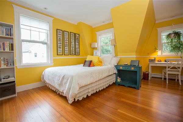 19 Cushing Road Wellesley, MA 02481 - Photo 22 of 29 a bedroom with a bed and wooden floor