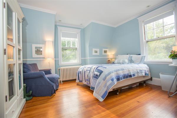 19 Cushing Road Wellesley, MA 02481 - Photo 23 of 29 a bedroom with a bed couch and two large window