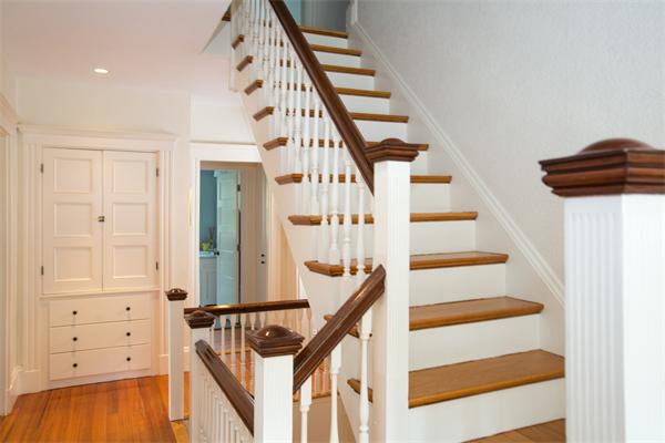 19 Cushing Road Wellesley, MA 02481 - Photo 25 of 29 a view of staircase with white walls and wooden floor