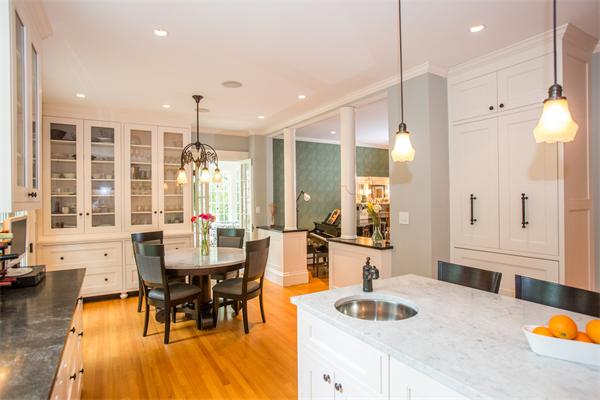 19 Cushing Road Wellesley, MA 02481 - Photo 6 of 29 a dining room with granite countertop wooden floor and a chandelier