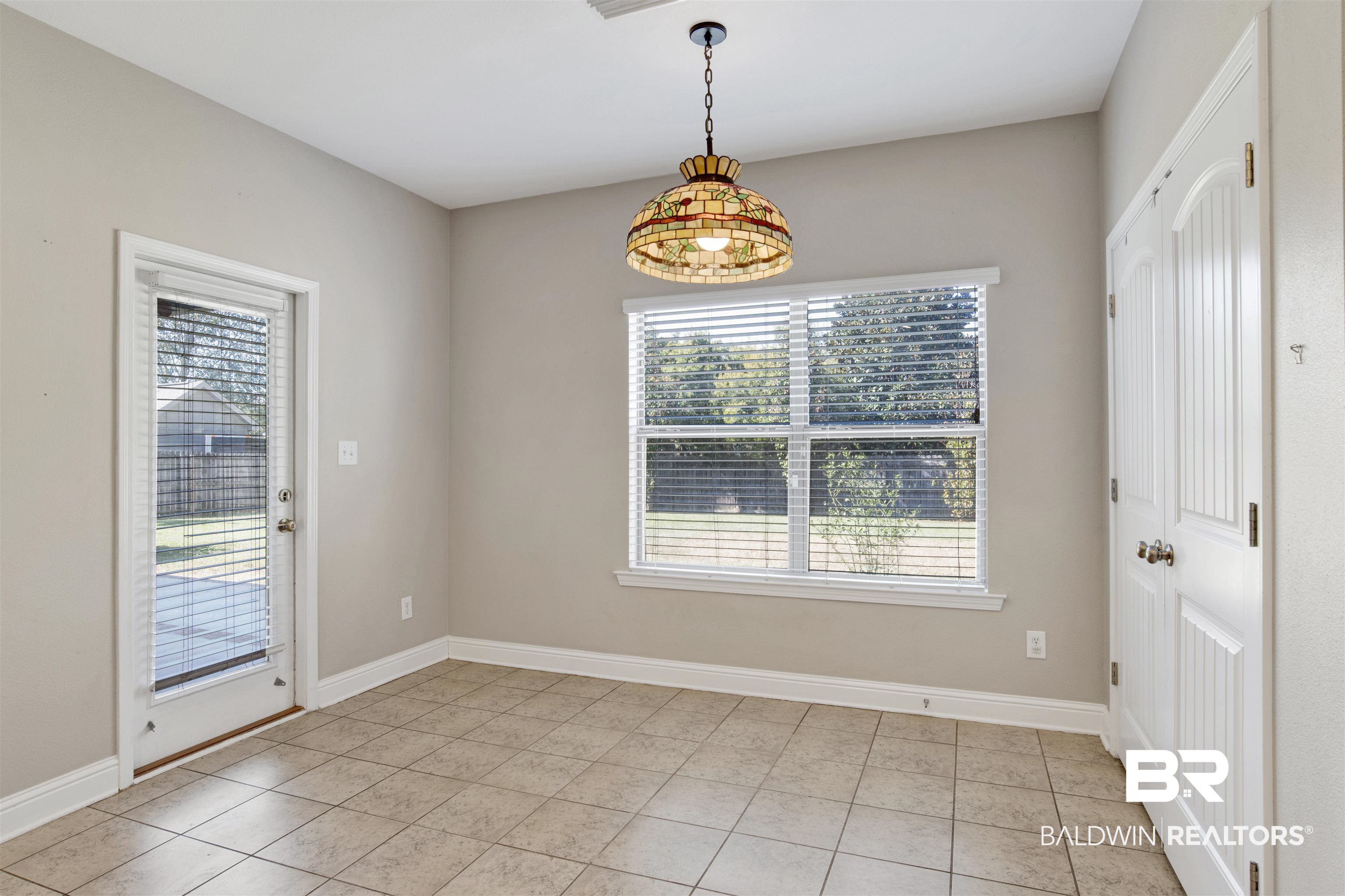 24159 Tullamore Drive Daphne, AL 36526 - Photo 14 of 31 Unfurnished dining area with light tile patterned floors