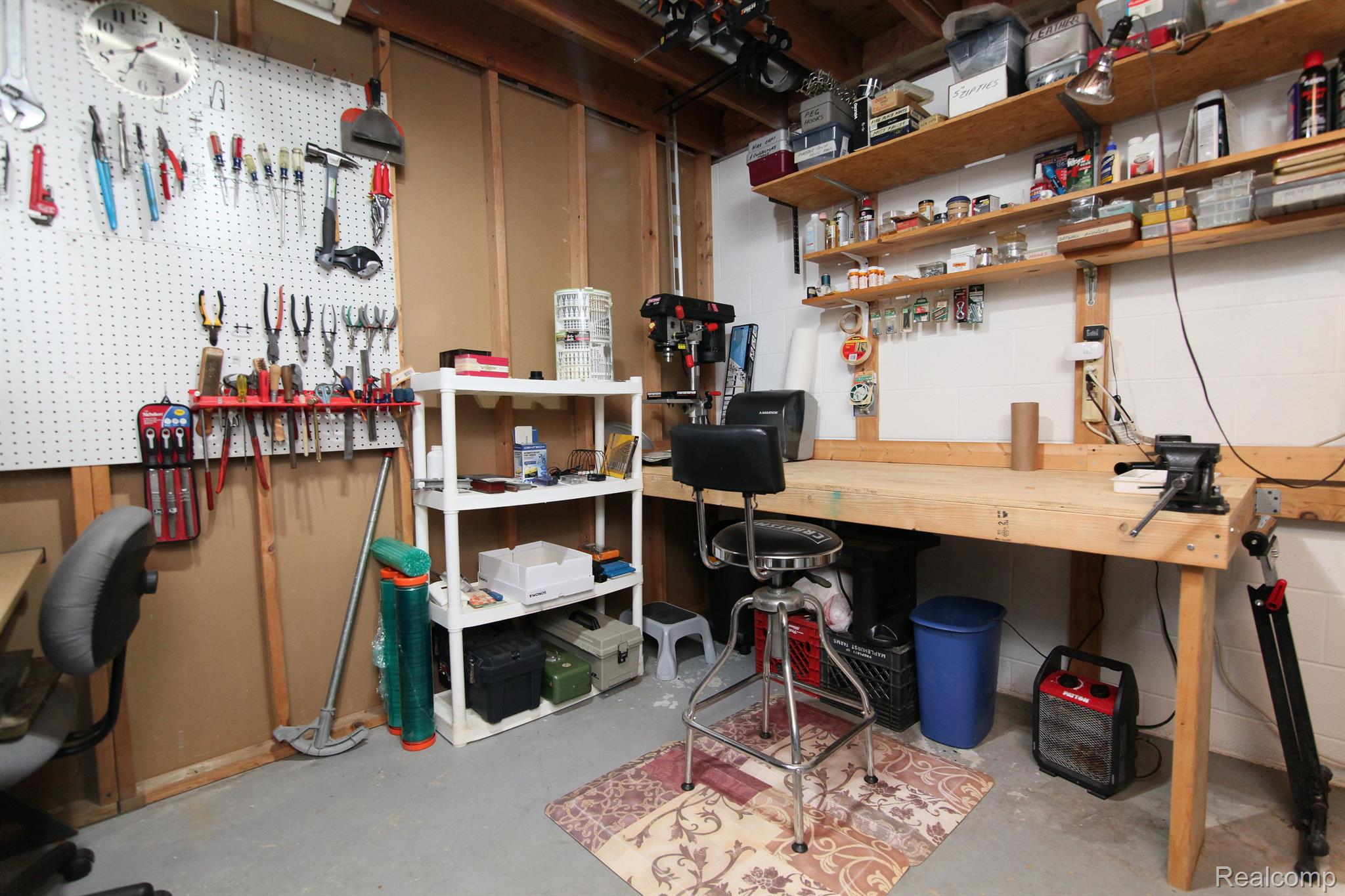 748 Sperry Road Allenton, MI 48002 - Photo 38 of 42 Basement Work Bench