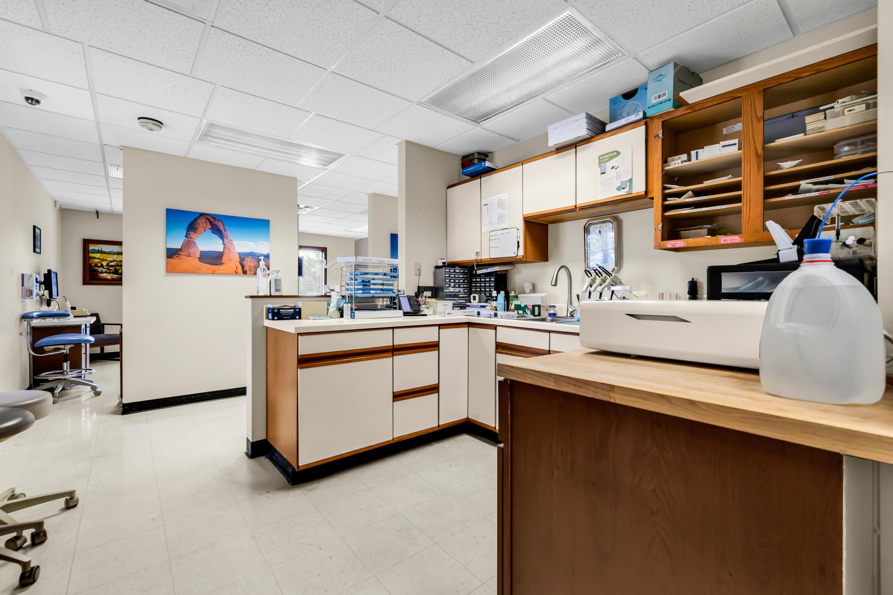 1240 Crescent Heights Road Marion, OH 43302 - Photo 25 of 60 • Neutral vinyl flooring • Ivory painted walls • Single bowl, stainless steel sink • Wall cabinets • Acoustic ceiling tiles • Fluorescent lighting
